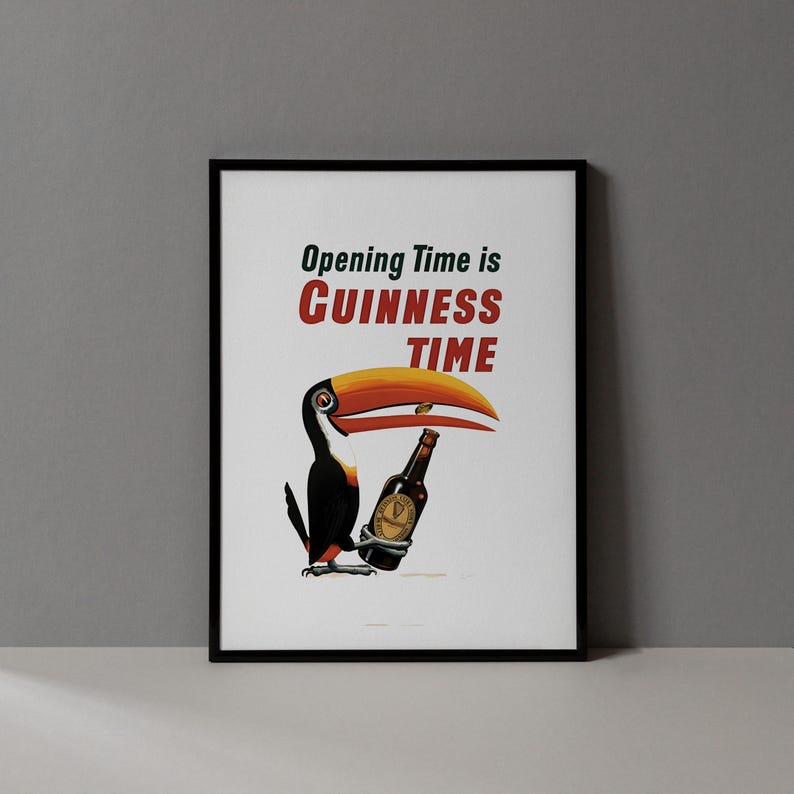May include: Framed print with a toucan and a Guinness bottle. The toucan has a large orange and yellow beak. The text "Opening Time is Guinness Time" is displayed in red and green.