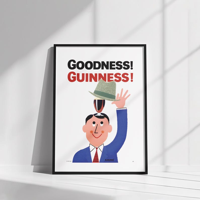 Puede incluir: Impresi&oacute;n art&iacute;stica enmarcada con una ilustraci&oacute;n de dibujos animados. Un hombre con traje azul y corbata roja sostiene un sombrero sobre su cabeza, con un vaso de Guinness equilibrado encima. Las palabras "GOODNESS! GUINNESS!" est&aacute;n impresas.