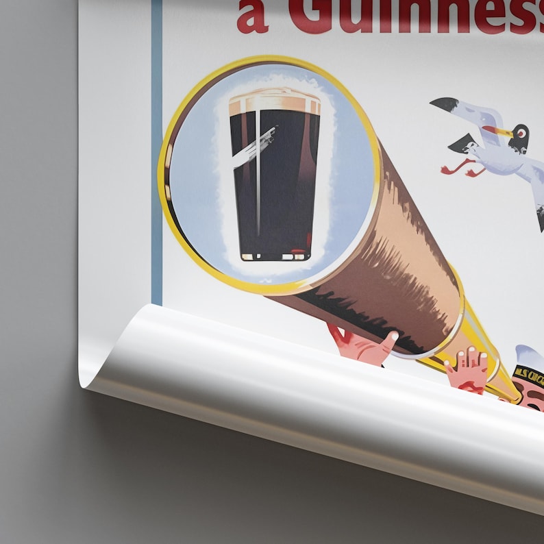 May include: Vintage Guinness advertisement poster. The poster features a pint of Guinness stout viewed through a telescope. The telescope is held by hands, and a seagull is in the background. The poster has a blue and white background with red text.