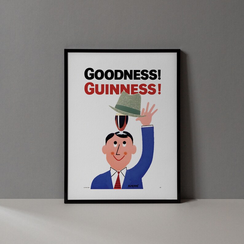 Puede incluir: Un p&oacute;ster vintage enmarcado con las palabras "GOODNESS! GUINNESS!" en negro y rojo. La ilustraci&oacute;n presenta a un hombre con un traje azul y corbata roja, equilibrando un sombrero en su cabeza y levantando la mano derecha.