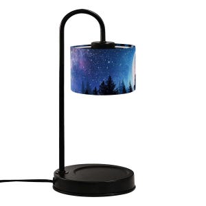 May include: A black metal table lamp with a curved arm and a round base. The lampshade features a nighttime forest scene with a starry sky, a full moon, and silhouetted trees. The lamp is plugged in.