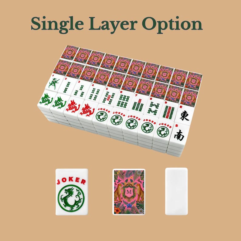 May include: A set of white mahjong tiles with green and red ink designs, including Joker tiles, numbered tiles, and directional characters. The back of the tiles features a pink floral pattern with two leopards and a central letter M. Text reads Single Layer Option.