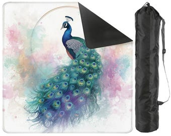 May include: A yoga mat featuring a watercolor peacock design in shades of blue, green, and purple. The mat has a white background with a black underside. A black carrying bag with a shoulder strap is included.