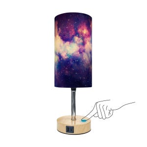 May include: A cylindrical table lamp with a galaxy design lampshade. The lamp has a wooden base with USB ports and a touch-sensitive power button. The lampshade displays a vibrant mix of purple, blue, and yellow hues, resembling a nebula.