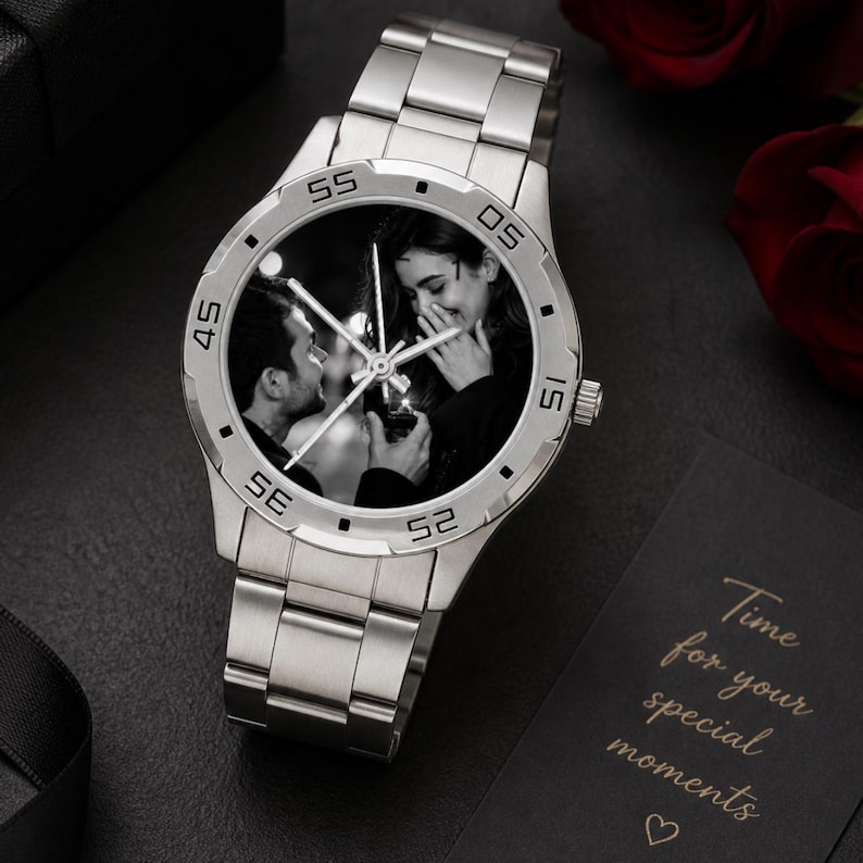 May include: Silver-toned wristwatch with a black and white photo of a couple on the watch face. The watch has a stainless steel band and a round face with minute markers. The text "Time for your special moments" is on a black card.