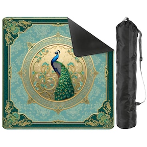 May include: A square outdoor blanket featuring a central circular medallion with a peacock illustration, surrounded by teal and gold damask patterns. The blanket has a black underside and comes with a black drawstring carrying bag with a shoulder strap.