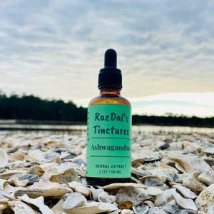 This picture showcases the Ashwagandha tincture herbal extract in the glass amber bottle that it comes in with free shipping.
