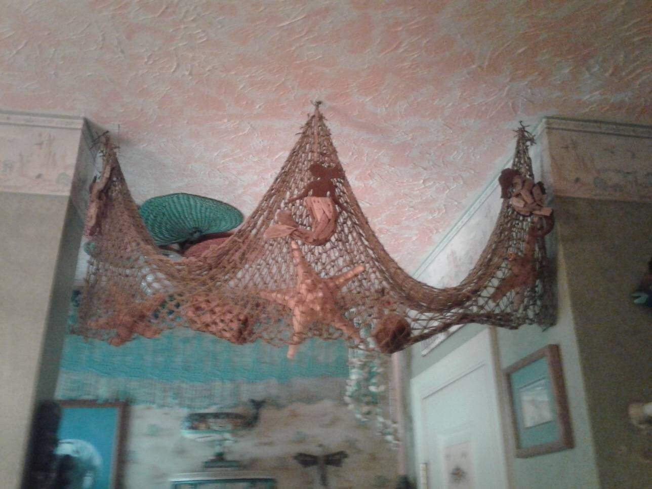 Fish net on ceiling  Fish net decor, Fishing net wall decor, Beach  inspired decor