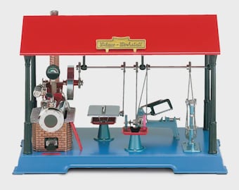 May include: A vintage toy workshop with a red roof and blue base. The workshop features a steam engine, saw, and other tools. The sign on the roof reads "Wilsco-Werkstatt".