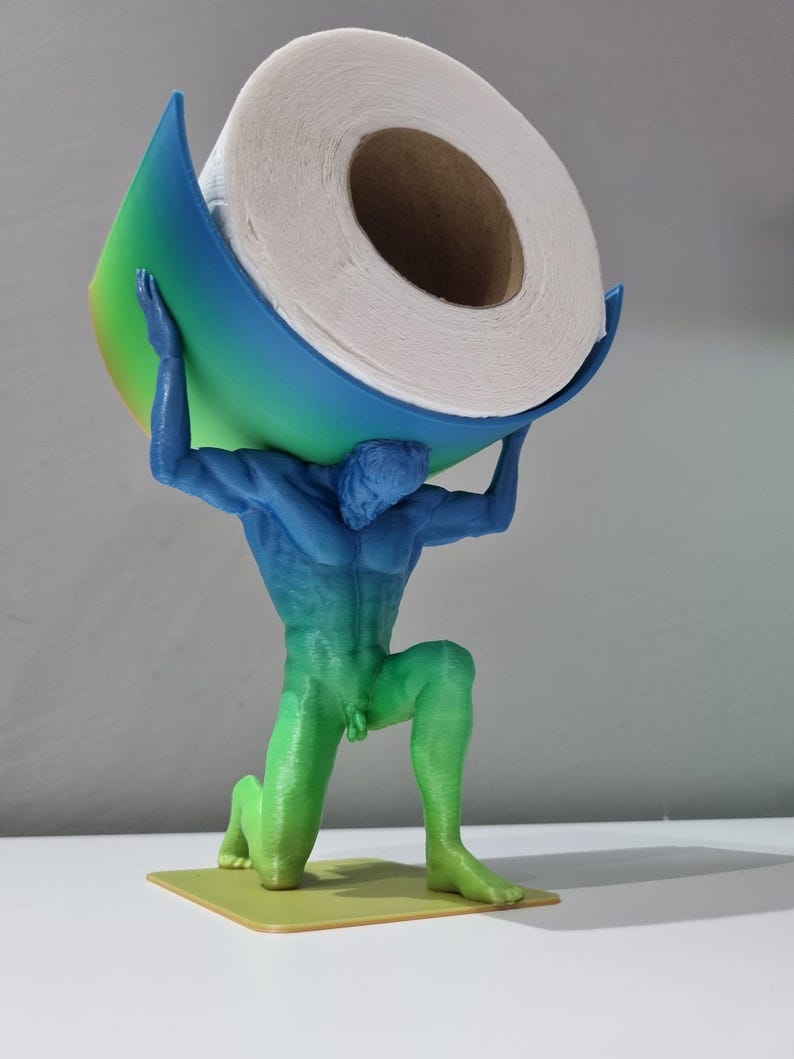 May include: A green, blue, and yellow 3D printed statue of a person holding a roll of toilet paper. The statue is kneeling and the toilet paper is balanced on the person's shoulders.