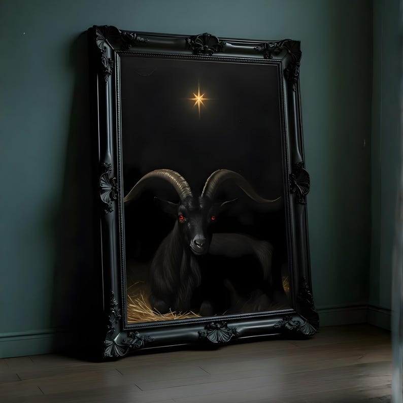 May include: A framed artwork depicting a black goat with red eyes, set against a dark backdrop with a shining star. The goat is resting on straw. The ornate black frame enhances the gothic style.
