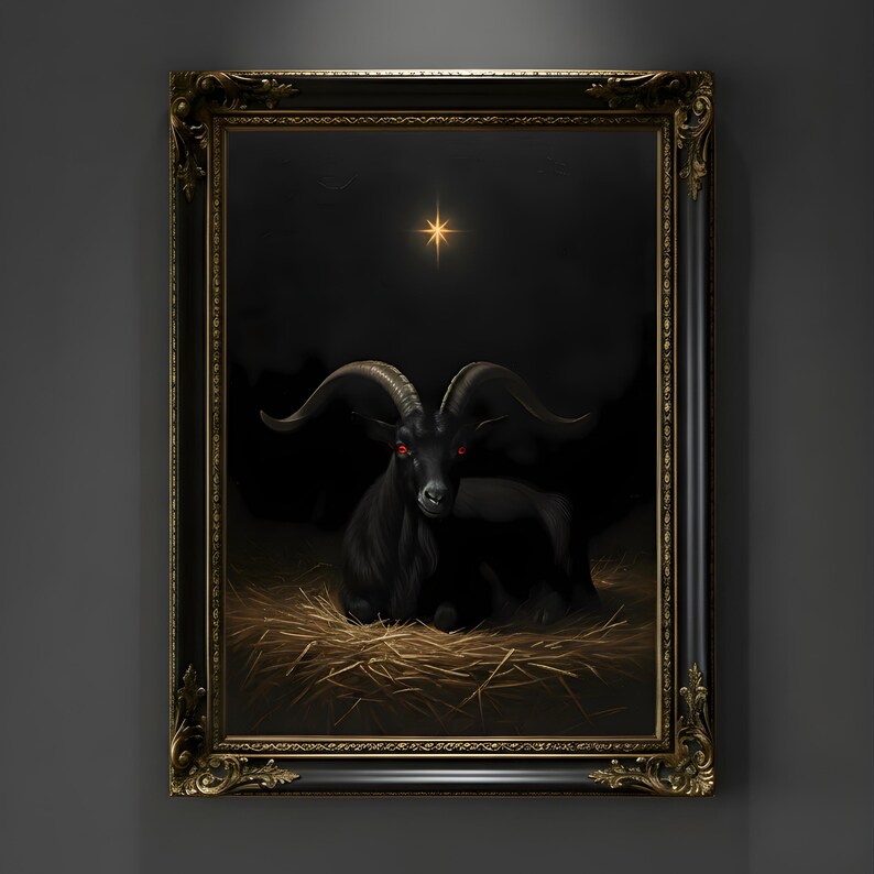 May include: A framed artwork depicting a black goat with red eyes, lying on straw. The background is dark with a star. The ornate frame is black with gold detailing, giving a gothic feel to the image.