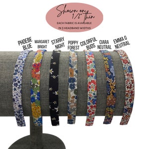 May include: A display of fabric headbands in various floral patterns. The headbands are labeled "Phoebe Blue," "Margaret Bright," "Starry Night," "Poppy Forest," "Colorful Buds," "Ciara Neutral," and "Emma G Neutral." The text "Shown on 1/2" thin" and "Each fabric is available in 3 headband widths" is also visible.
