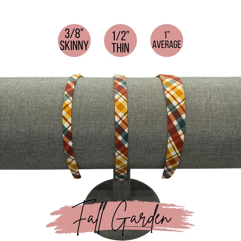 May include: Three plaid fabric headbands in different widths: 3/8 inch skinny, 1/2 inch thin, and 1 inch average. The headbands are displayed on a gray fabric headband stand. The text "Fall Garden" is written in pink on a white background.
