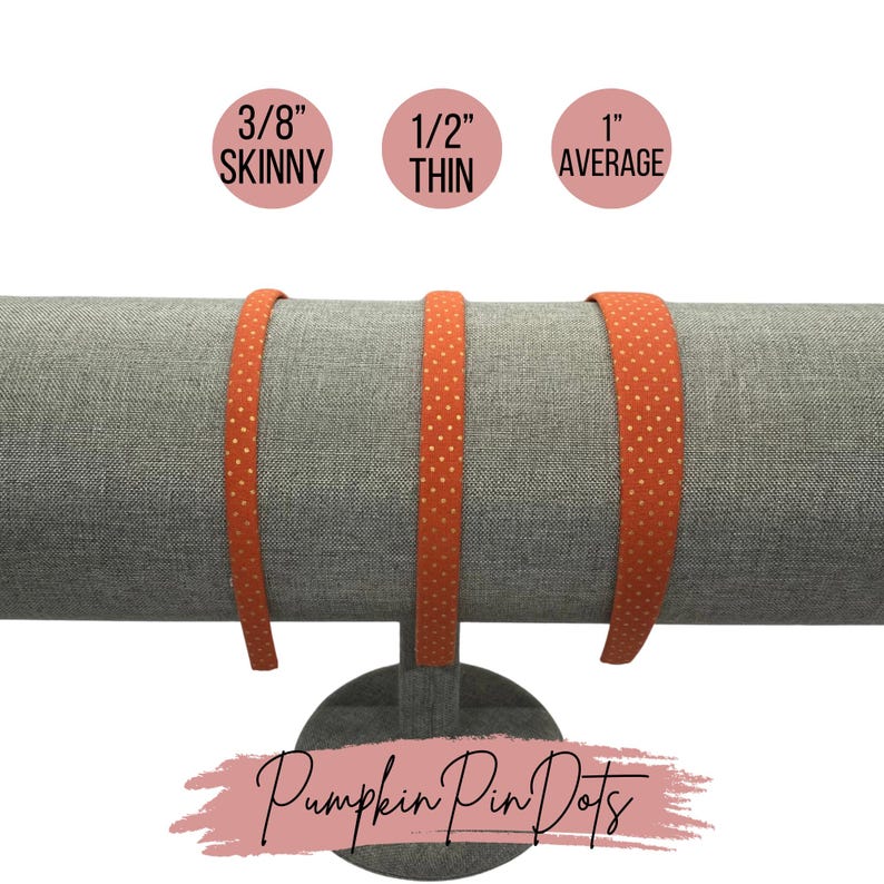 May include: Three orange headbands with white polka dots on a gray fabric stand. The headbands are labeled 3/8" Skinny, 1/2" Thin, and 1" Average. The text "Pumpkin Pin Dots" is written in pink on a white background.