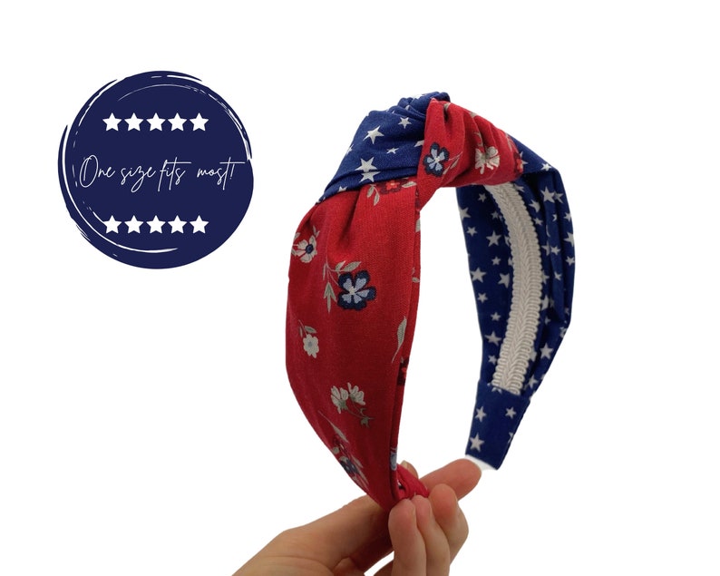 May include: Red and blue knotted headband with a floral pattern on one side and a white star pattern on the other side. "One size fits most" is written on a blue circle with white stars.
