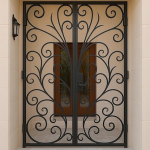 May include: Black wrought iron double door with an ornate scrollwork design. The door features a central handle and hinges, set against a light beige wall. A dark brown door is visible behind the ironwork, with a black outdoor wall lamp on the left.