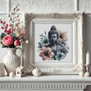 May include: A framed print of a Buddha statue with blue, brown, and pink flowers. The white frame has decorative detailing. A white vase with flowers and a candle holder are also visible.