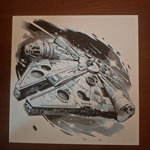 May include: A black and white illustration of the Millennium Falcon spaceship flying through space. The spaceship is detailed with a variety of hatches and panels. The background is a dark blue with white stars.