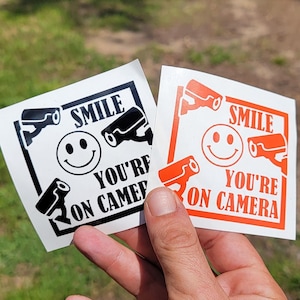 Video Surveillance Smile You're On Camera Vinyl Decal - Area under Surveillance Sticker, CCTV Security Camera Sign, Smile You're On Camera