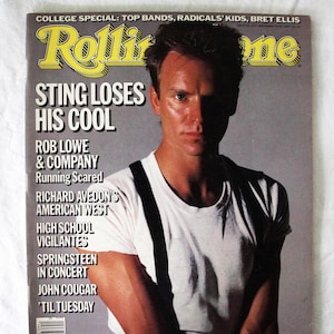 May include: A vintage Rolling Stone magazine cover with Sting as the main feature. The headline reads "Sting Loses His Cool." Other articles mentioned include Rob Lowe and Springsteen. The magazine has a yellow and grey color scheme.