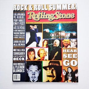 May include: A vintage Rolling Stone magazine cover with the headline "ROCK & ROLL SUMMER!" and the Rolling Stone logo. Features images of musicians and celebrities, including Kiss, Metallica, and Sandra Bullock. The cover also lists concert tours and chart toppers.