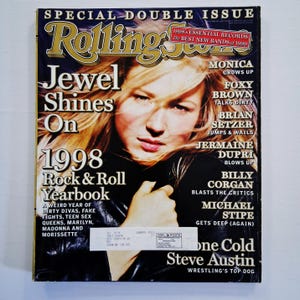 May include: A Rolling Stone magazine cover featuring Jewel. The cover has the text "Jewel Shines On 1998 Rock & Roll Yearbook." Additional text includes "Special Double Issue" and names of musicians and bands.
