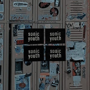 May include: A collage of vintage lockers covered in stickers and graffiti. Four black squares with the band name "sonic youth" in white text are centered. The lockers are a muted brown color.
