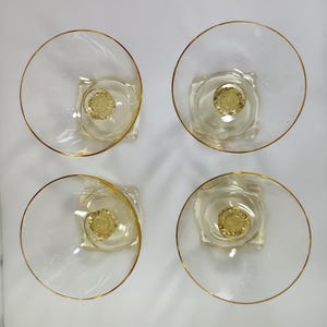 Set of 4 yellow sherbet glasses.