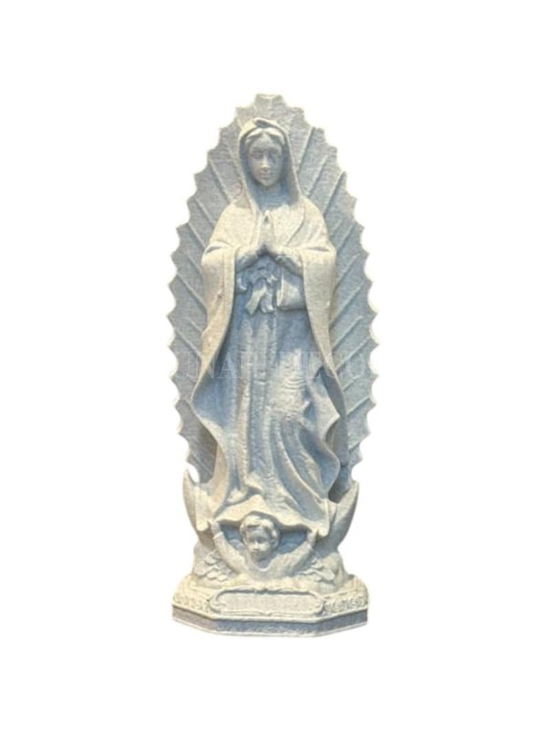 May include: A grey stone statue of the Virgin Mary with hands clasped in prayer. The statue features detailed robes and a halo-like backdrop. A small cherub is at the base of the statue.