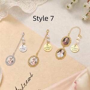 May include: Three memorial charms with oval photo frames and round metal tags engraved with the text you are always in my heart. The charms feature silver or gold-toned metal filigree borders, small white faux pearls, and link chains.
