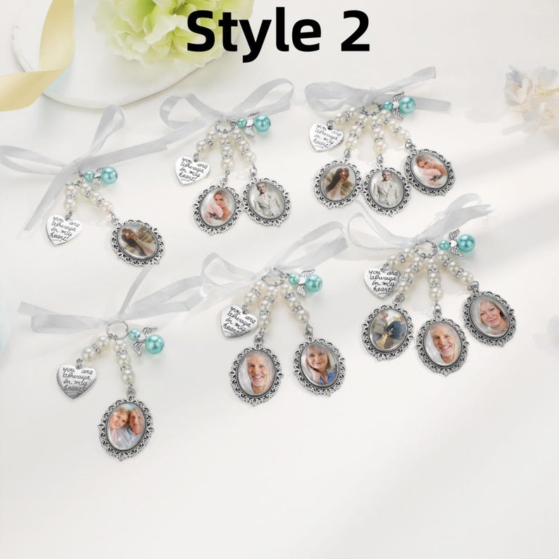 May include: Six memorial photo charms featuring silver-toned oval frames, white pearl beads, teal accent beads, and heart-shaped charms engraved with the text You are always in my heart. Each charm is tied with a white satin ribbon bow.