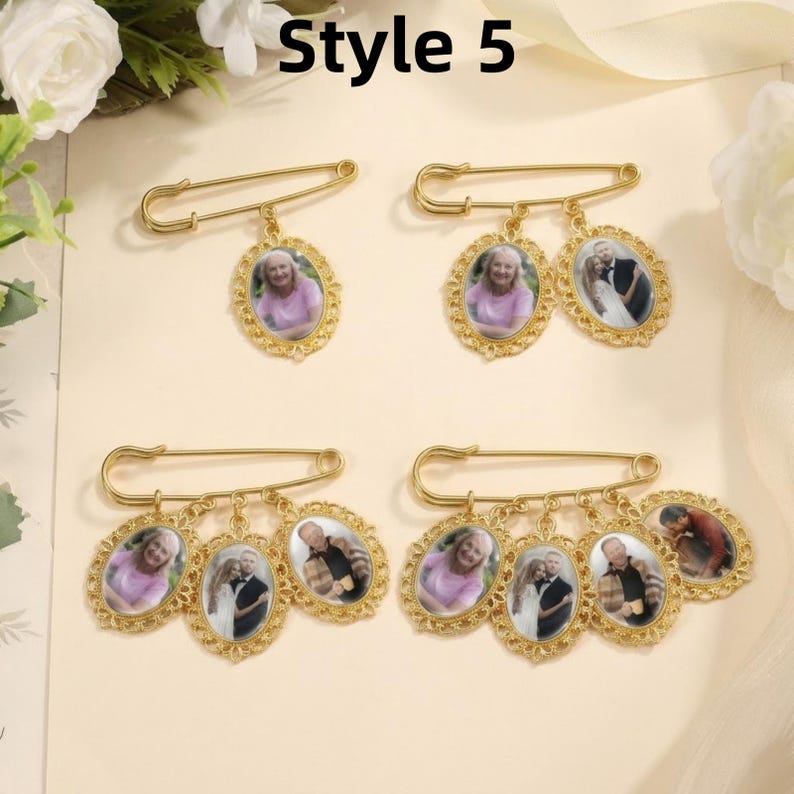May include: Four gold-toned safety pins labeled Style 5, each featuring oval-shaped pendants with scalloped edges. The pendants contain small portrait photographs of individuals and couples, suspended from the pins by small metal jump rings.