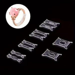 May include: Clear plastic ring size adjusters in various shapes and sizes. A rose gold ring with a pink gemstone is shown in a circle in the upper left corner. The adjusters are designed to make rings fit more snugly.