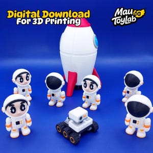 May include: A white and red rocket ship with a blue accent, surrounded by toy astronauts in white suits and helmets. A small white and black rover is in front of the astronauts. The text "Digital Download For 3D Printing" is at the top.