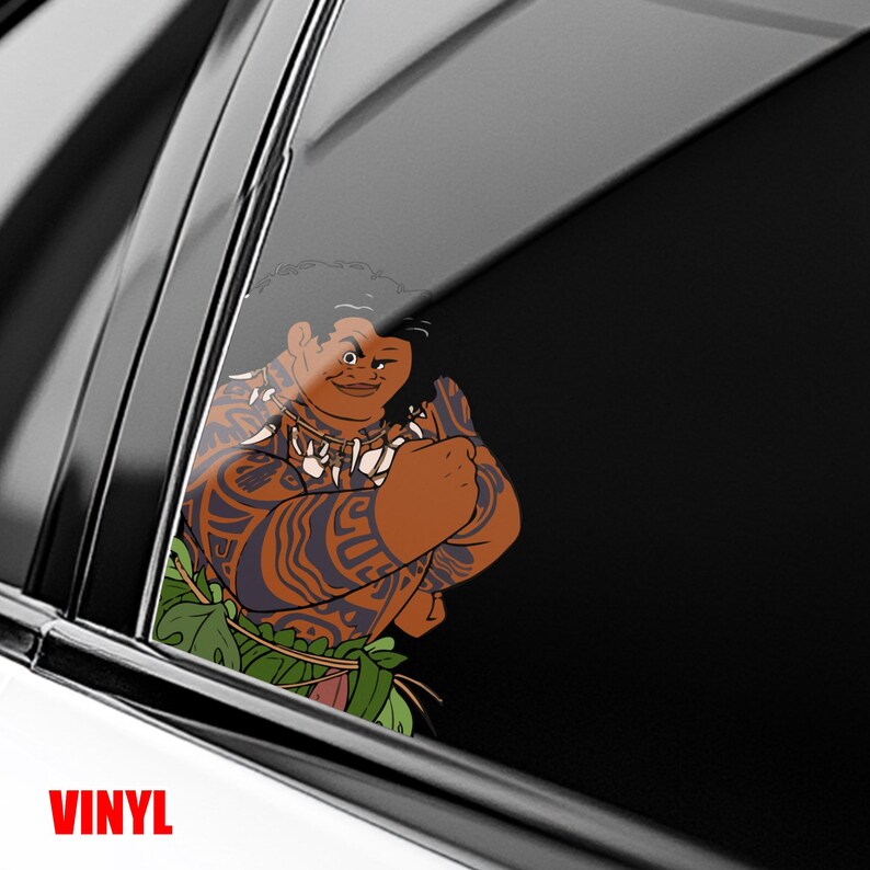 May include: A vinyl decal featuring a cartoon character with brown skin, intricate tattoos, and a necklace. The character is wearing a green skirt and is winking. The word "VINYL" is printed in red at the bottom.