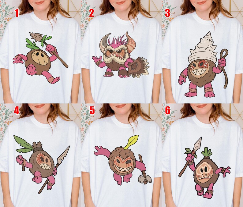 Puede incluir: Camisetas blancas con ilustraciones de dibujos animados de personajes tribales o fant&aacute;sticos. Cada dise&ntilde;o presenta una criatura &uacute;nica con varios colores y accesorios, como lanzas, garrotes y tocados. Las ilustraciones son de estilo caricaturesco.