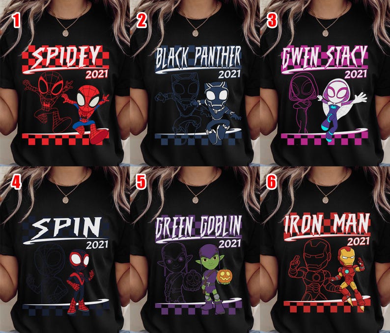 May include: Black t-shirts with superhero graphics. Each shirt has a character's name and "2021" in white or purple text. The designs include Spidey, Black Panther, Gwen Stacy, Spin, Green Goblin, and Iron Man.