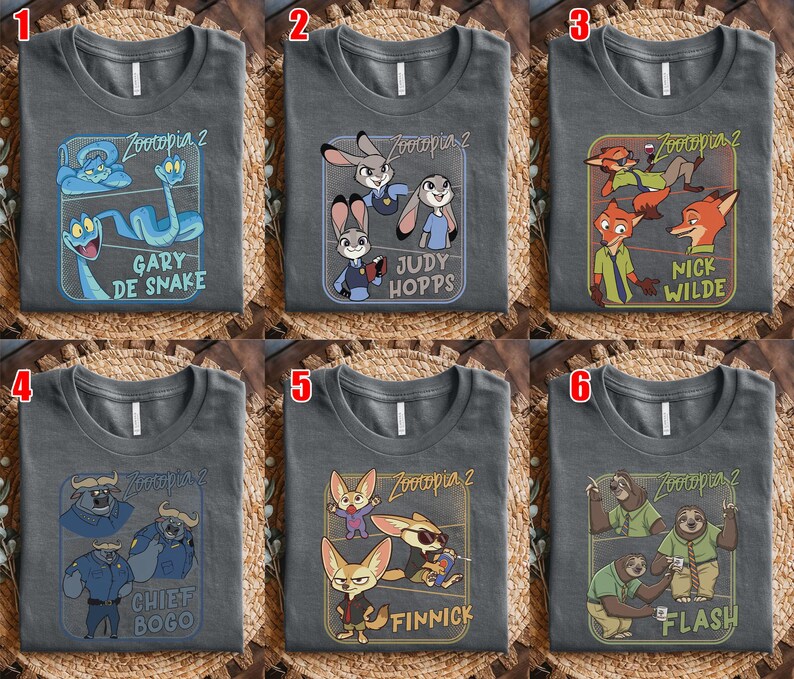 May include: Six gray t-shirts with different character designs from the movie "Zootopia 2". Each shirt features a different character or group of characters, including Gary De Snake, Judy Hopps, Nick Wilde, Chief Bogo, Finnick, and Flash.