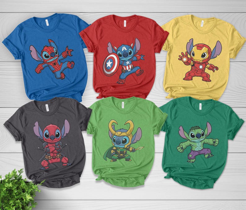 May include: Six colorful t-shirts featuring cartoon character Stitch in various superhero costumes. The shirts are blue, red, yellow, gray, green, and dark green. Each shirt has a different superhero theme, including Spider-Man, Captain America, Iron Man, Deadpool, Loki, and Hulk.