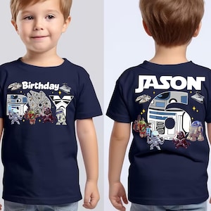 May include: Navy blue t-shirt with a Star Wars theme. The front features the word "Birthday" and "BOY" with Star Wars characters. The back of the shirt has the name "JASON" and a large "6" with Star Wars characters.