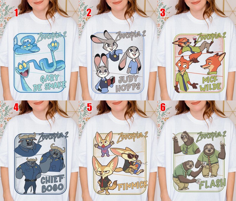 May include: White t-shirts featuring characters from the animated movie "Zootopia 2". Each shirt displays a different character or group of characters, including Gary De Snake, Judy Hopps, Nick Wilde, Chief Bogo, Finnick, and Flash.