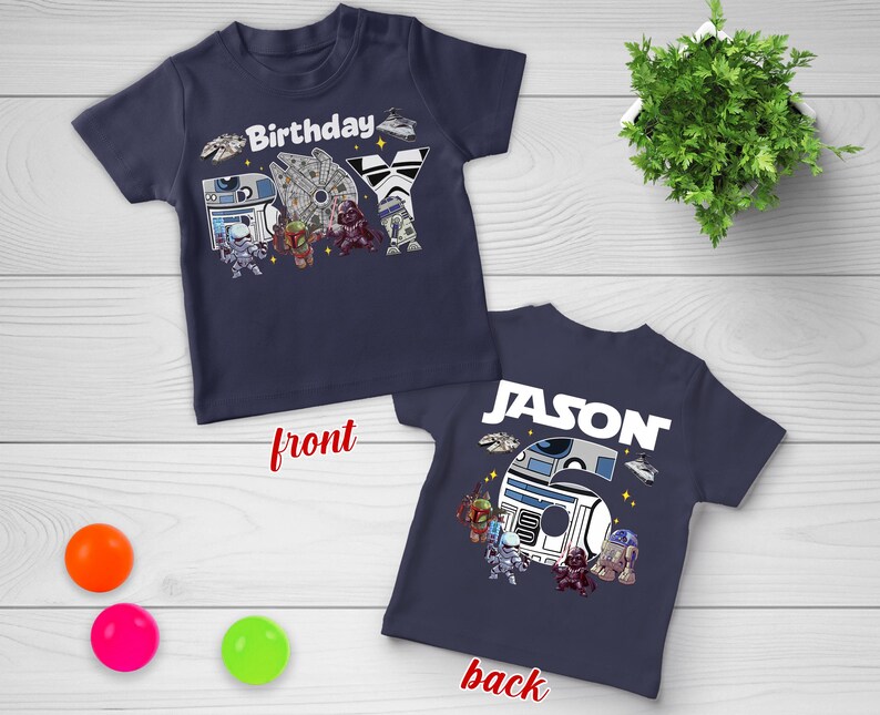 May include: Navy blue short-sleeved t-shirt with a Star Wars theme. The front features the word "Birthday" and various characters. The back has the name "JASON" and the number "6".