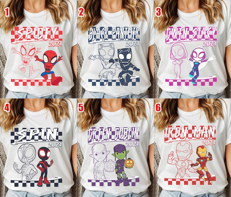 May include: White t-shirts with superhero graphics. Each shirt displays a different character or pair, with the year 2021. The designs include Spidey, Black Panther, Gwen Stacy, Spin, Green Goblin, and Iron Man.