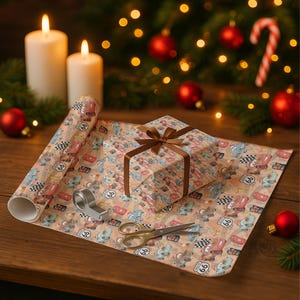 May include: A roll of wrapping paper and a wrapped gift box with a brown ribbon, both featuring a Route 66 and car design. A pair of scissors, tape dispenser, and two lit candles are also visible. The scene is set against a Christmas tree background.