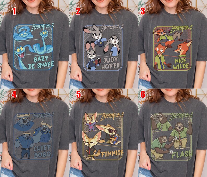 May include: Six dark gray t-shirts featuring characters from the animated film "Zootopia 2". Each shirt has a different design, including "Gary de Snake", "Judy Hopps", "Nick Wilde", "Chief Bogo", "Finnick", and "Flash".