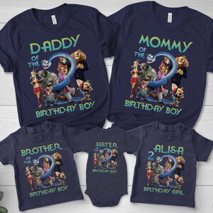May include: Navy blue t-shirts with cartoon characters and text. The shirts read "Daddy of the Birthday Boy", "Mommy of the Birthday Boy", "Brother of the Birthday Boy", "Sister of the Birthday Boy", and "Alisa 2 Birthday Girl".