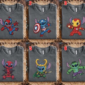 May include: Six gray t-shirts with different Stitch character designs. The designs include Stitch as Spider-Man, Captain America, Iron Man, Deadpool, Loki, and the Hulk. Each shirt has a unique graphic of Stitch in a superhero costume.