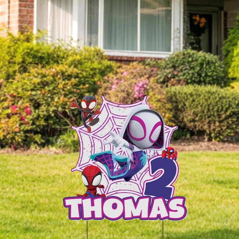 A Spider-Man themed birthday sign for a child named Thomas, featuring Spider-Man characters and the number "2".