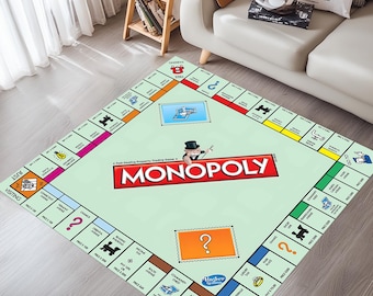 May include: A large Monopoly board game rug with a light green background. The rug features the Monopoly logo in red and white, property spaces, and Chance and Community Chest cards. The rug is rectangular and placed on a wooden floor.